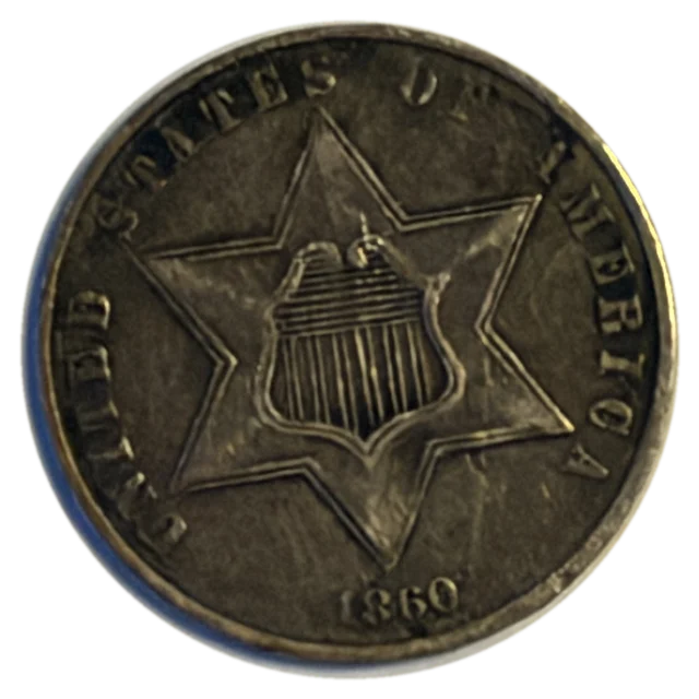 1860 three-cent silver piece, front: a six-pointed star with the U.S. shield