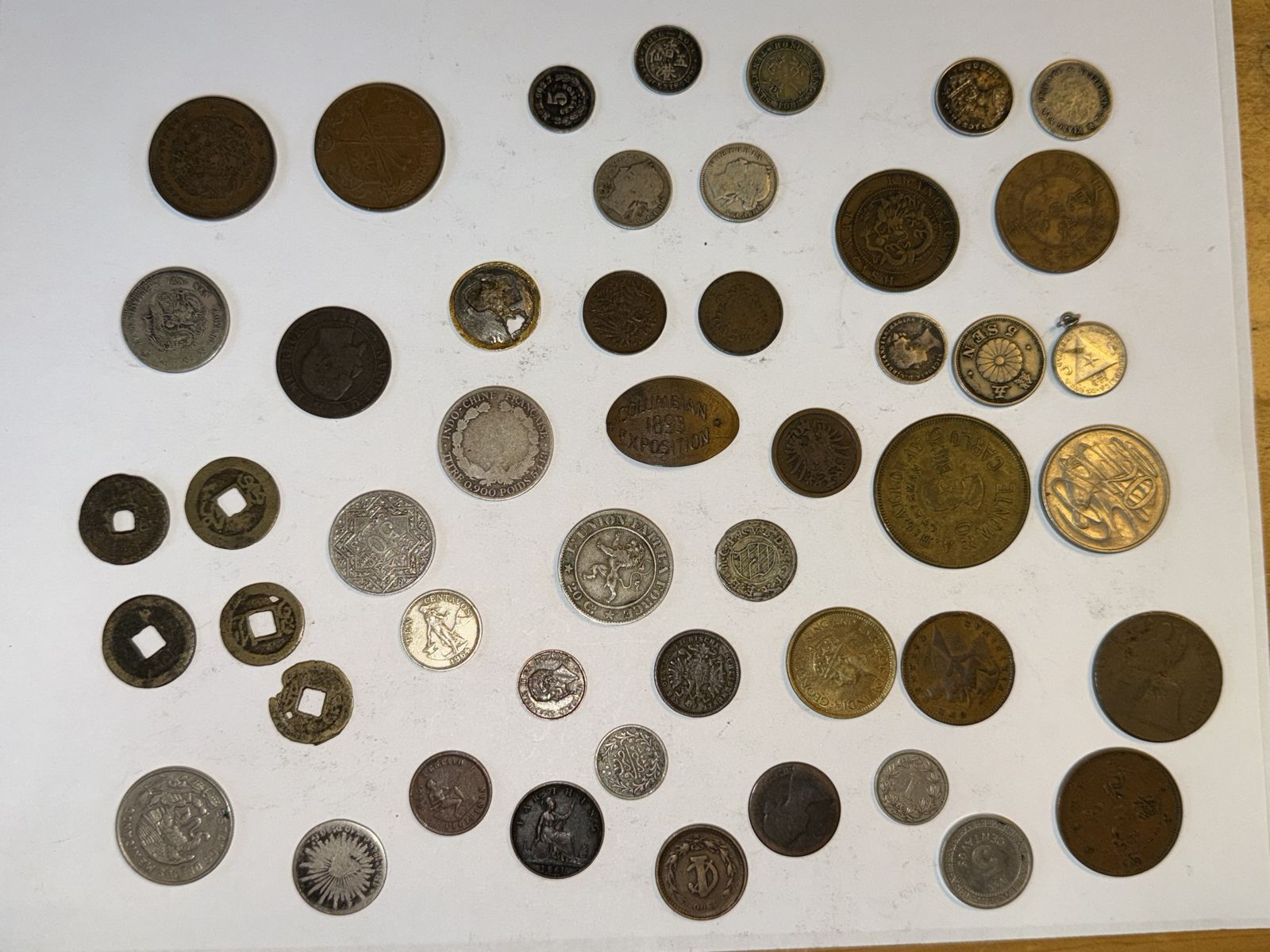 Tray of coins from around the world